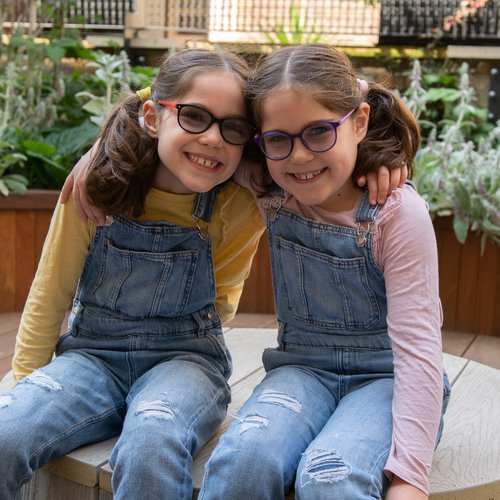 GOSH patients Iona and Beth in the sensory garden in the Sight and Sound Centre supported by Premier Inn