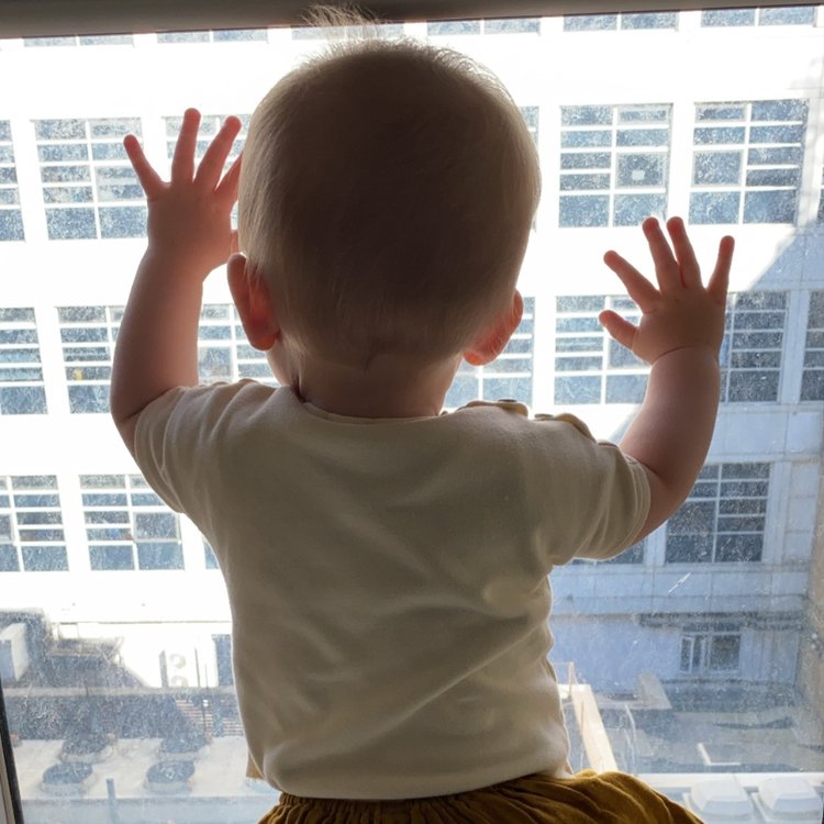Arlo looking out of the window from room at GOSH