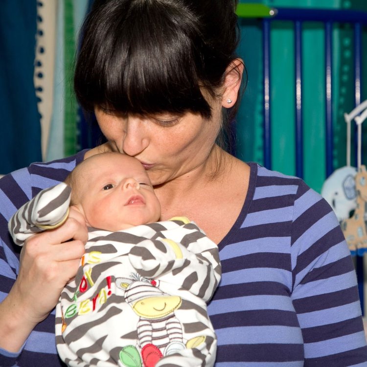 Lisa holds baby Sophia at GOSH