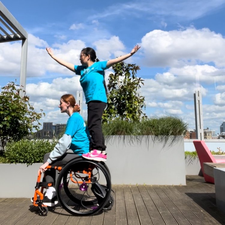 Two members of GOSH Arts performing  a routine outside.