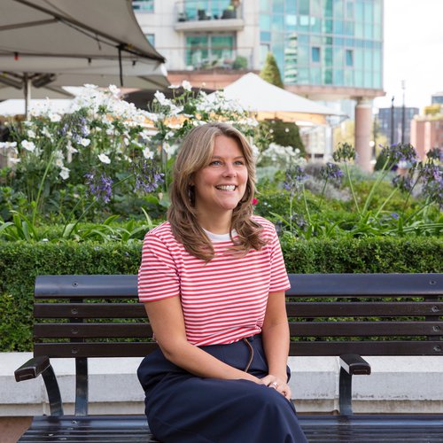 Emma sitting outside, smiling to camera