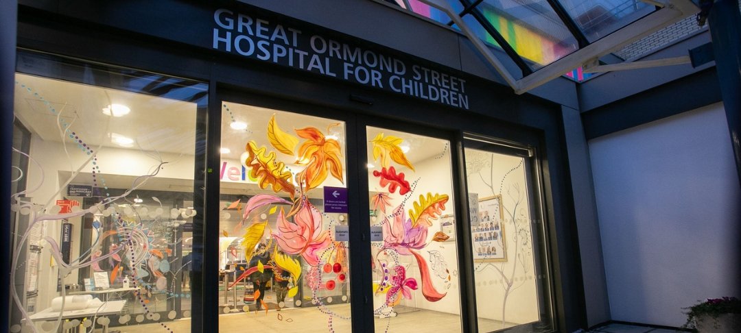GOSH entrance's sliding doors with leaves and flowers painted on them.
