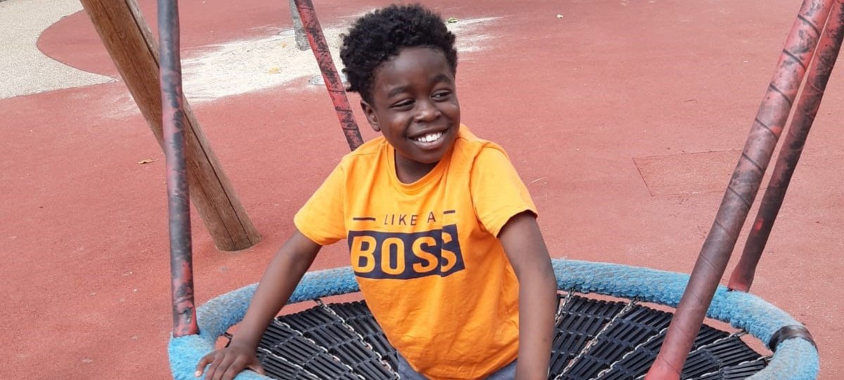 GOSH patient Gabriel smiling and playing in park.