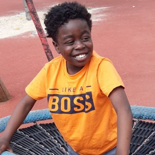 GOSH patient Gabriel smiling and playing in park.