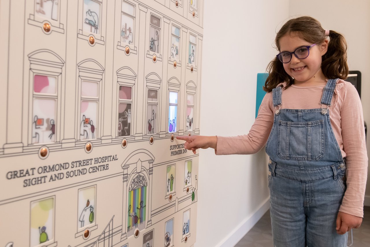 GOSH patient explores the centre's Wayfinding dolls house