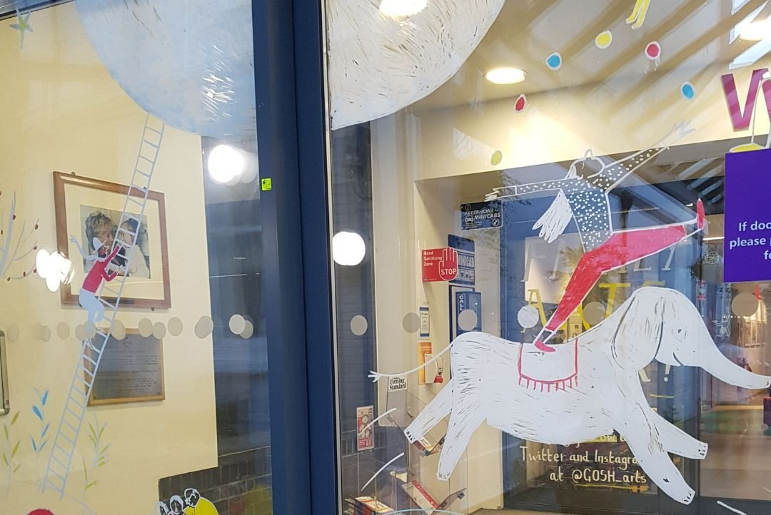 illustrations of a hot air balloon on GOSH entrance sliding doors