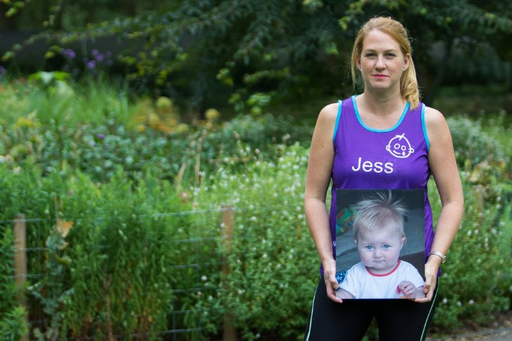 Jess holds a photo of her daughter
