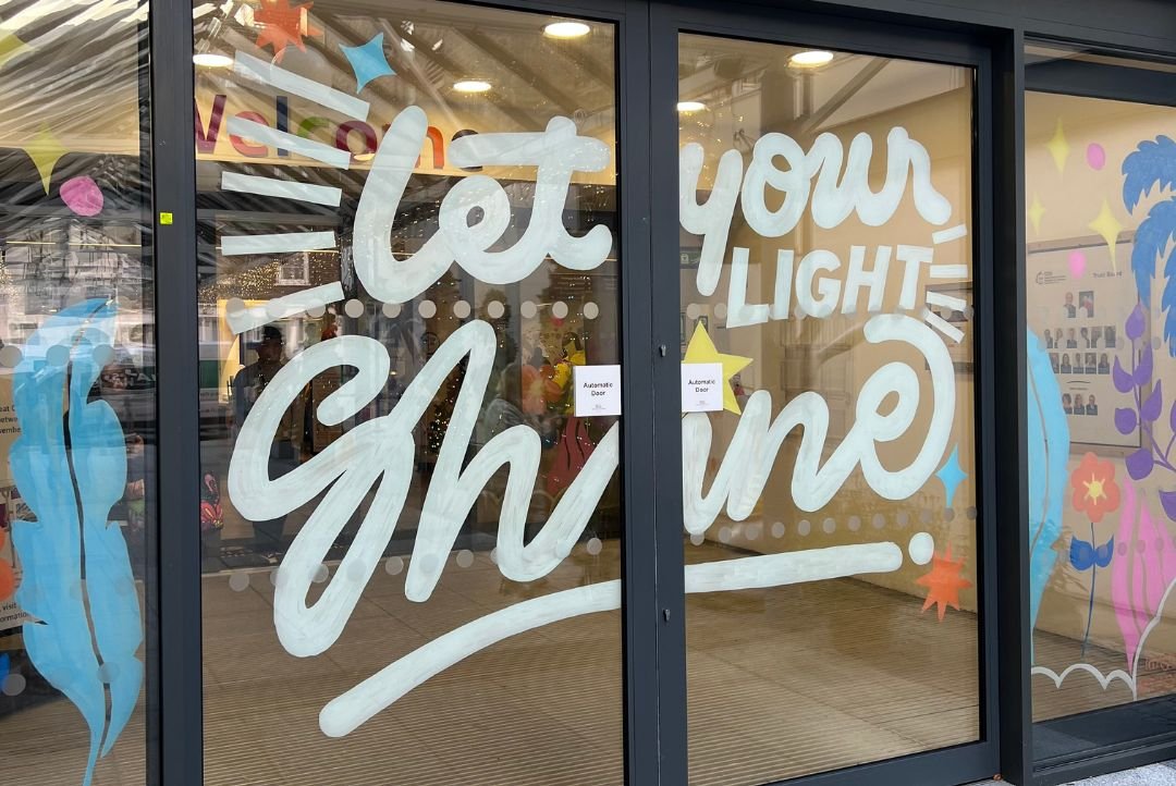 Words reading Let your light shine painted on GOSH entrance sliding doors