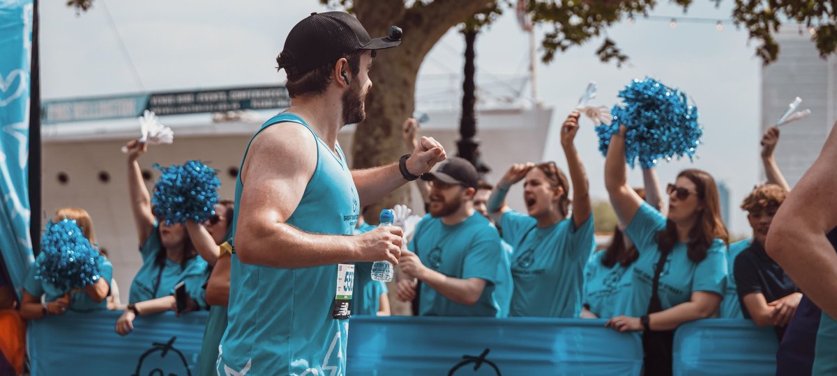 London Marathon runner, running past as GOSH Charity cheer station