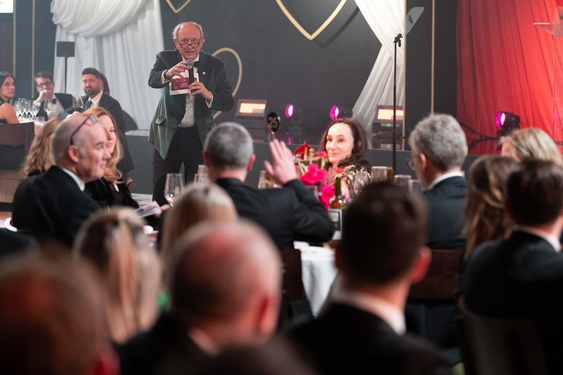 Charlie Ross pointing at bidder during Love GOSH auction