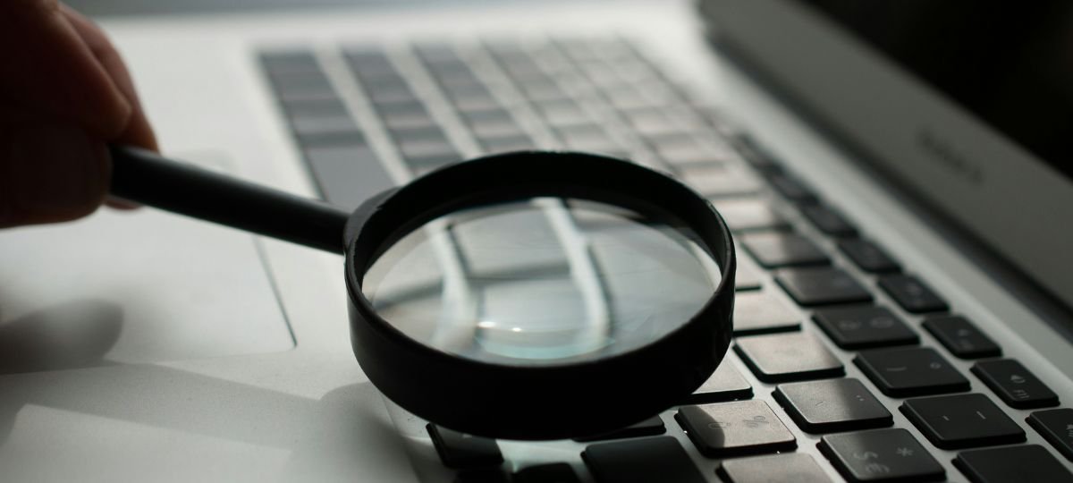 magnifying glass and laptop