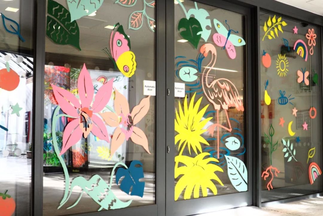 Painted illustrations on GOSH entrance sliding doors