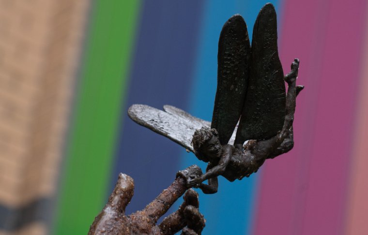 Sculpture of Tinkerbell holding an outstretched hand