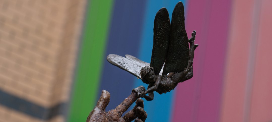 Sculpture of Tinkerbell holding an outstretched hand