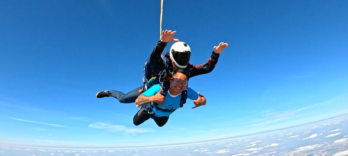 Skydiver jumping from plane