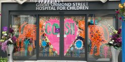 illustration of tigers and heart on GOSH entrance sliding doors