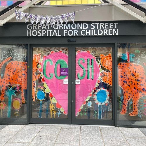 illustration of tigers and heart on GOSH entrance sliding doors
