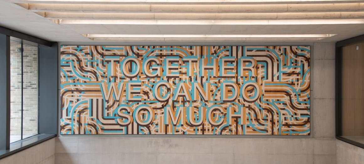 Artwork on the wall at the Zayed Centre for Research reading "Together we can do so much"