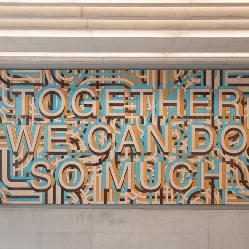 Artwork on the wall at the Zayed Centre for Research reading "Together we can do so much"