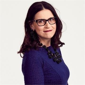 Professional headshot of woman looking to camera