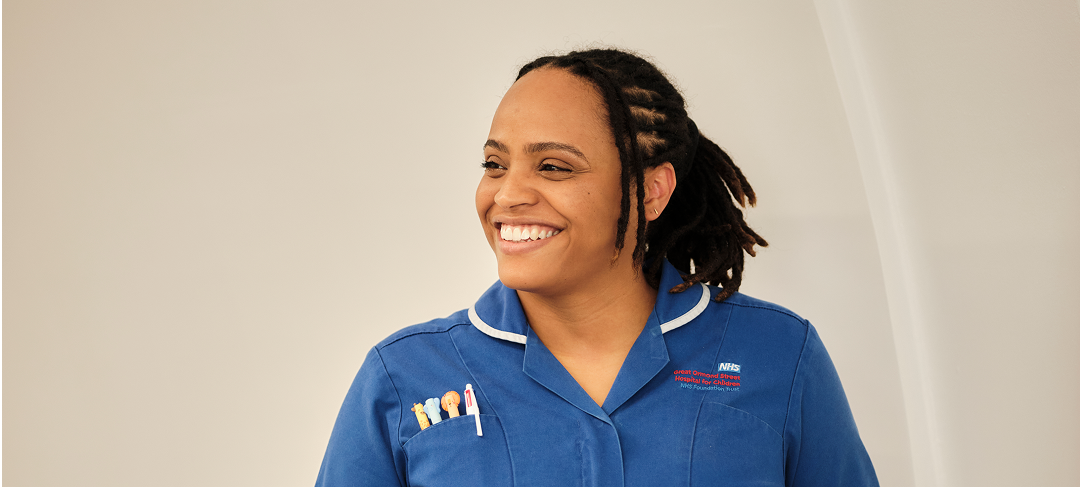 Nurse photographed on ward, smiling