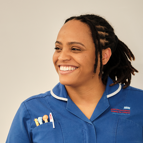 Nurse photographed on ward, smiling