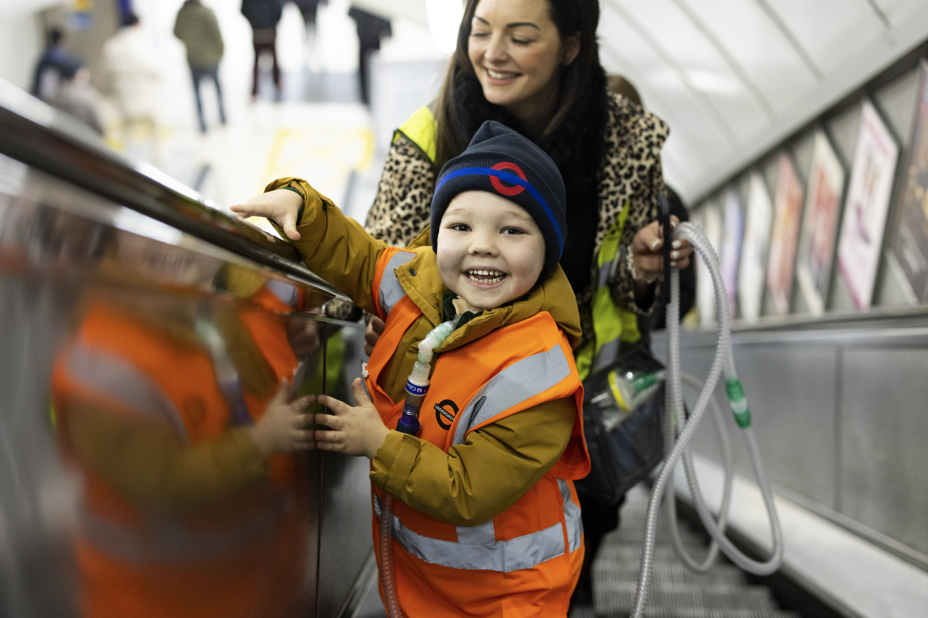 Henry and his mum on the escalator in the London Underground